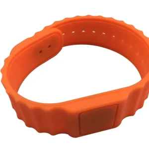 'Nar 13.56 MHz RFID Wristband made of orange silicone, featuring a clasp, perforations for size adjustment, and integrated RFID technology.