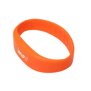 Custom RFID Bracelet showcasing a sleek orange design with an integrated electronic tag.