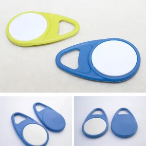 The image displays three "RFID Key Fob Tag (1)" items in various colors: nk'axt'i, blue with a white center, and solid blue. These key fobs are likely intended for identification or electronic applications.